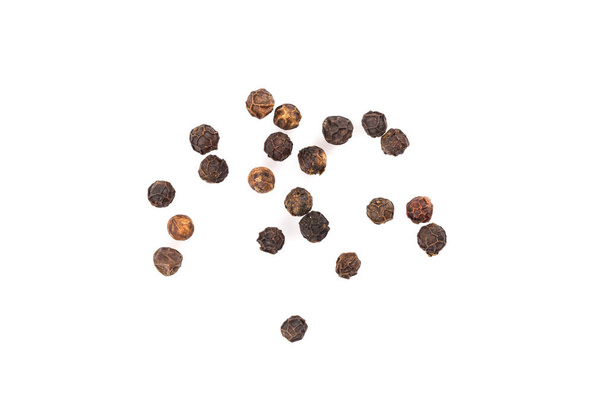 Black pepper seeds on a white background - Foto, afbeelding
