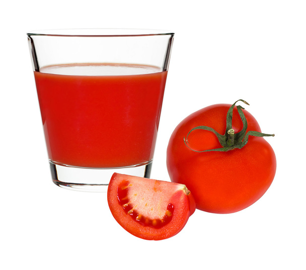 succo di pomodoro in un bicchiere e pomodori rossi su uno sfondo bianco
 - Foto, immagini