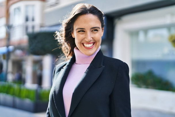 Young hispanic woman smiling confident standing at street - Fotó, kép