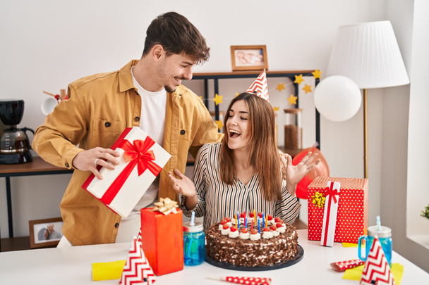Mand and woman couple having birthday celebration at home - Foto, imagen