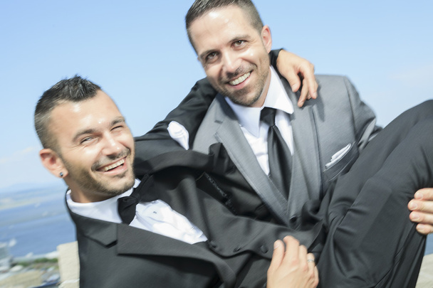 Portrait of a loving gay male couple on their wedding day. - Foto, Bild
