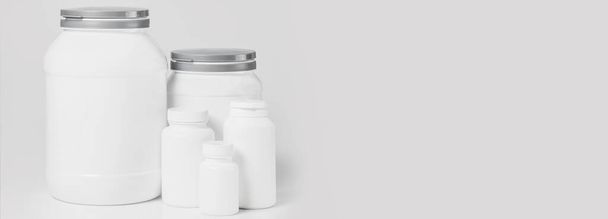 Mockup of white food supplement jars on gray background - Photo, Image