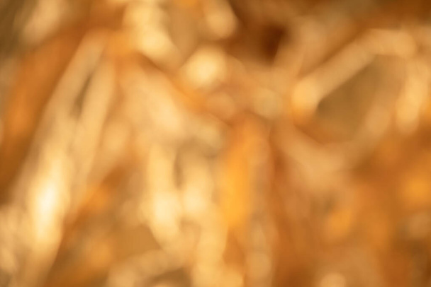 Closeup of abstract out of focus golden metallic background - Foto, Imagen