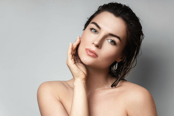 Portrait of young and beautiful woman with wet body and hair - Photo, Image