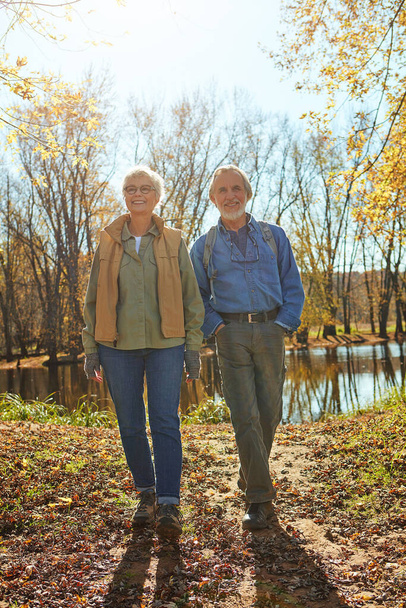 Spending their retirement with good old Mother Nature. a happy senior couple exploring nature together - Foto, Imagem