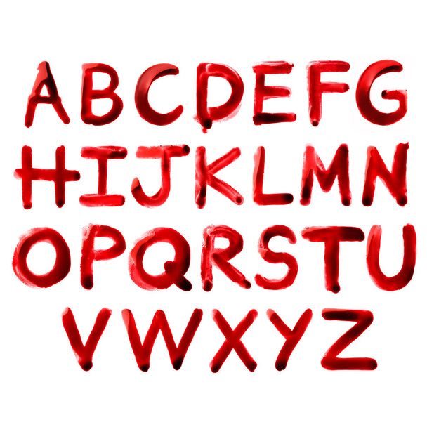 Bloody font. Letters drawn with real red paint looking like blood isolated on white background. Graphic resources and design elements. - Photo, Image