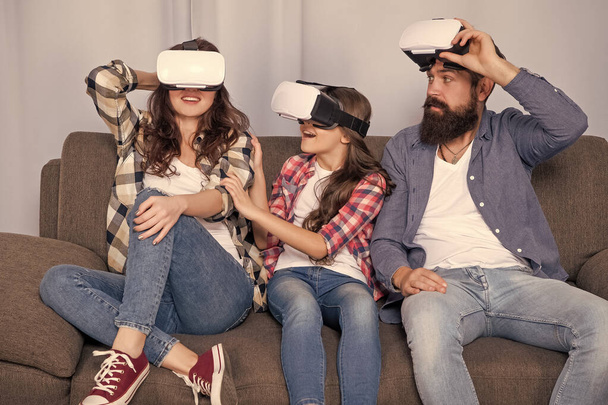 father mother and child wireless glasses. virtual reality family. happy parents with kid girl use modern technology. mom dad and daughter. digital future and innovation. modern life. - 写真・画像