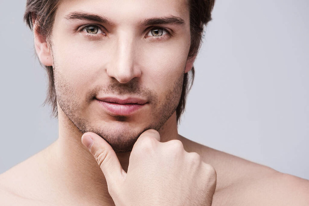 Portrait of young handsome man with a stubble beard - Foto, Imagen
