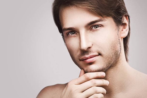 Portrait of young handsome man with a stubble beard - Zdjęcie, obraz