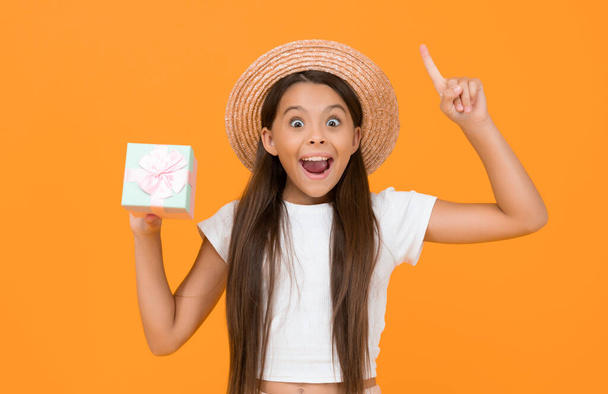 inspired teen child hold present box on yellow background. - Foto, Imagem