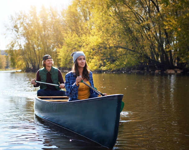 Boyfriends make great paddling partners. a young couple going for a canoe ride on the lake - Photo, Image