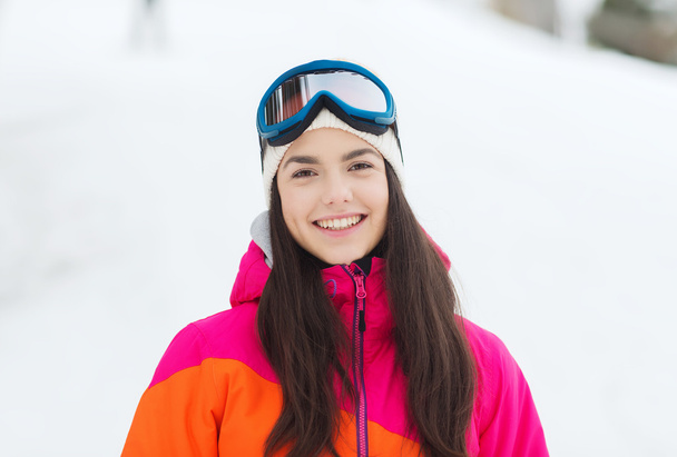 happy young woman in ski goggles outdoors - Foto, immagini