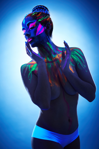 Relaxed topless girl posing with luminous makeup - Foto, Imagen