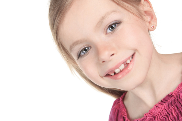 A beautiful girl child over a white background. - Foto, imagen