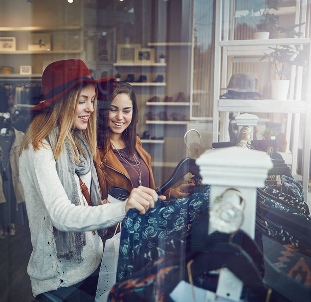 But I already have something like this. two best friends out shopping in a clothing store - Foto, imagen