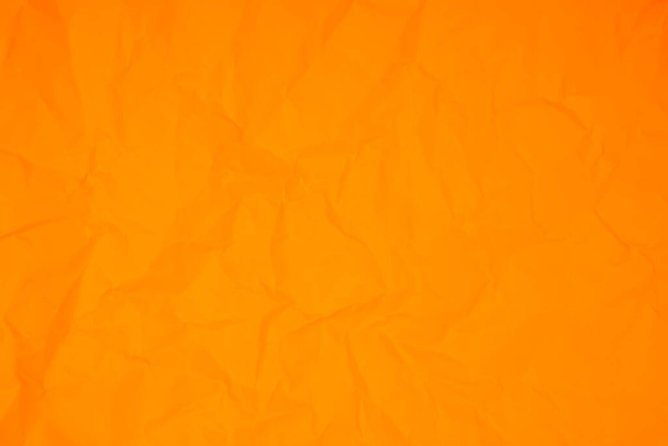 Orange color crumpled paper texture background - Foto, Imagen