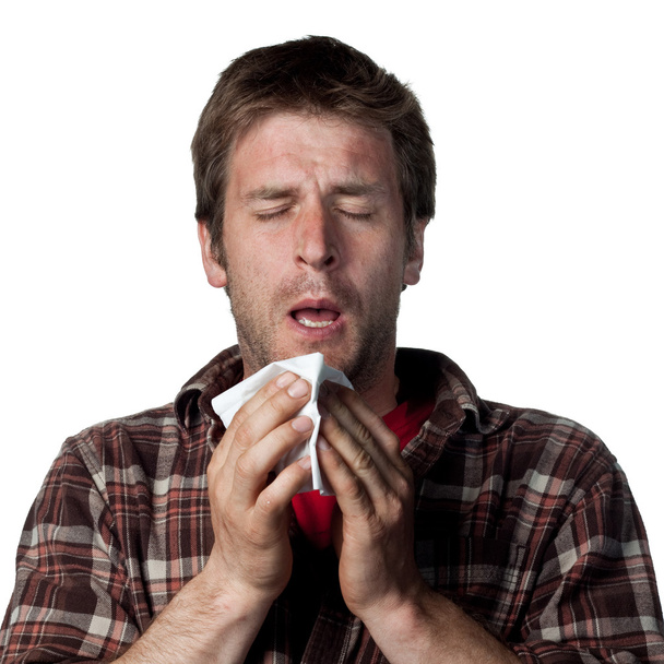 Молодой человек чихает
 - Фото, изображение