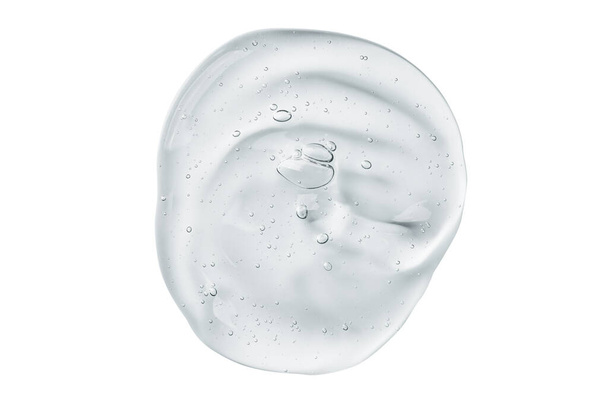 Muestra de gel sérico aislada sobre fondo blanco. textura de suero de gel transparente cosmético. - Foto, imagen