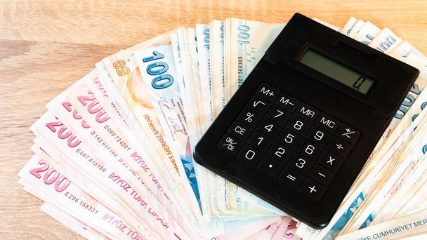 Turkish lira banknotes and calculator. Accounting concept. - Valokuva, kuva