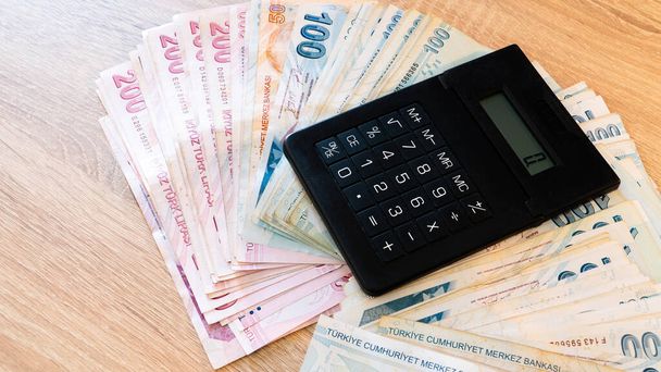 Turkish lira banknotes and calculator. Accounting concept. - Fotografie, Obrázek