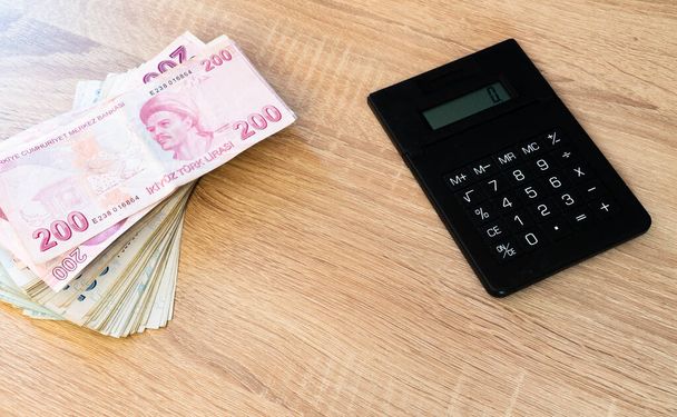 Turkish lira banknotes and calculator. Accounting concept. - Fotografie, Obrázek