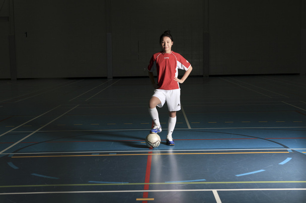 A female soccer player in a stadium - Foto, Bild