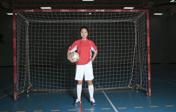 A female soccer player in a stadium - Foto, Imagem