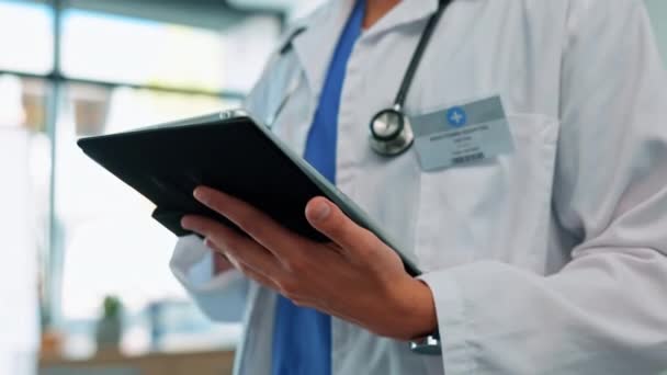Medical, doctor and tablet in hands for healthcare, medicine and health insurance research. Male worker in a hospital for internet search, professional care and telehealth advice on wellness app. - Footage, Video