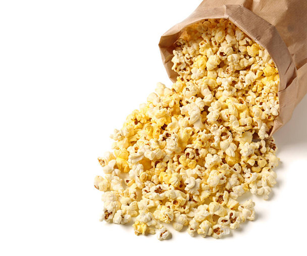 Paper bag with crispy popcorn on white background - Zdjęcie, obraz