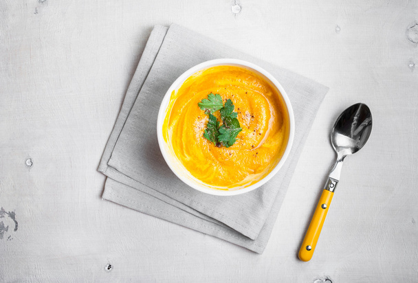 Pumpkin soup with parsley background - Фото, изображение