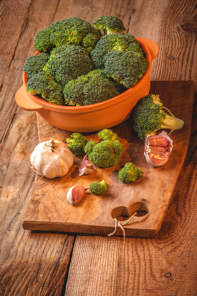 Green delicious broccoli on a wooden rustic table - Fotografie, Obrázek