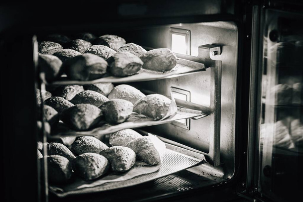 Pastry, cookies, croissants, baguette and bread are being made - Fotografie, Obrázek