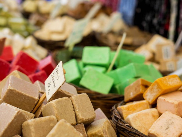 A selective focus of colorful square soap pieces in wooden baskets - Foto, immagini