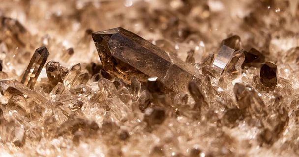 A closeup of a smashed pile of brown crystals, smoky quartz - Fotoğraf, Görsel