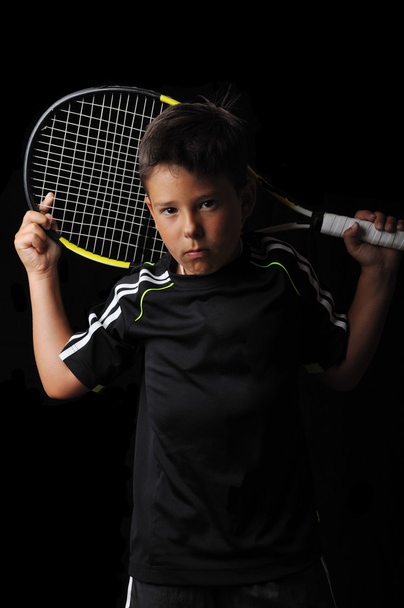 Tennis boy isolated in black - Photo, image