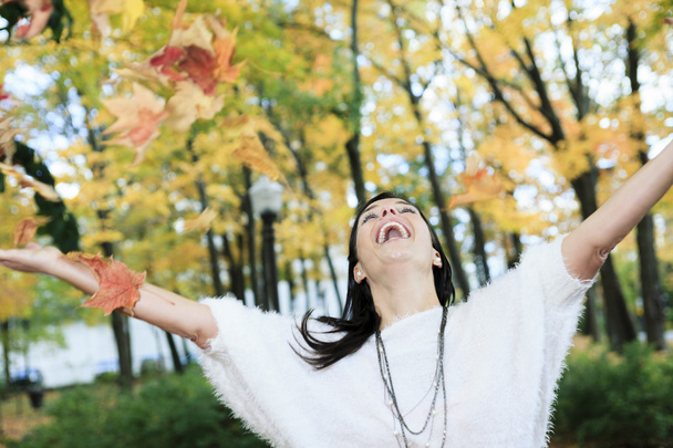 A beautiful autumn woman having good time. - Photo, Image