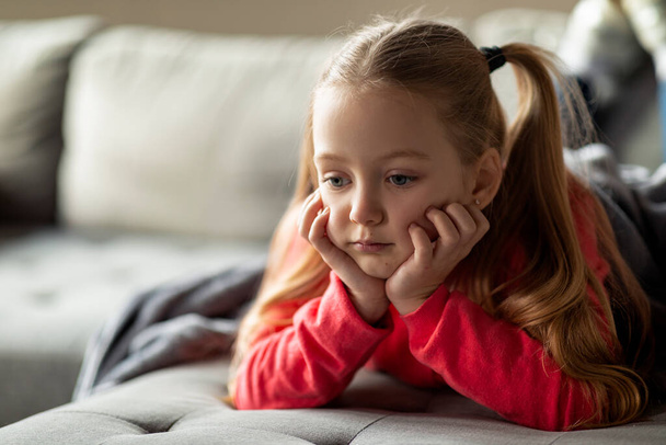 Pensive Upset Little Girl Relaxing On Couch At Home, Closeup Shot Of Thoughtful Sad Preteen Female Child Lying On Sofa In Living Room, Feeling Depressed And Lonely, Closeup Shot With Copy Space - Fotoğraf, Görsel
