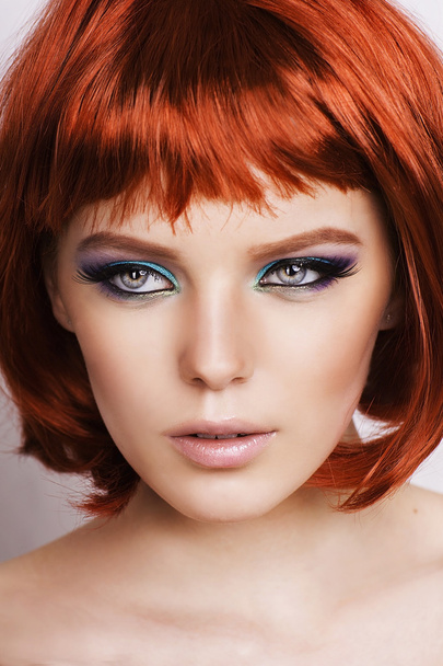 Beautiful stylish woman with red hair on white background. - Valokuva, kuva