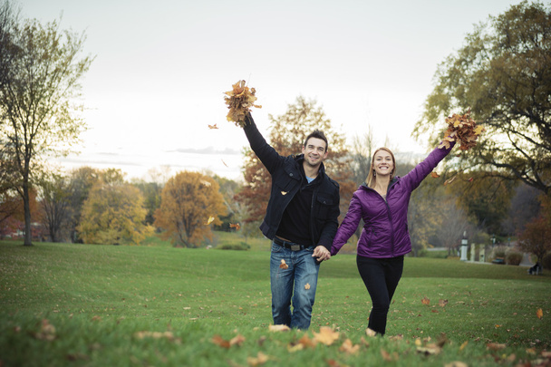 A Young happy couple in autumn season - Fotoğraf, Görsel