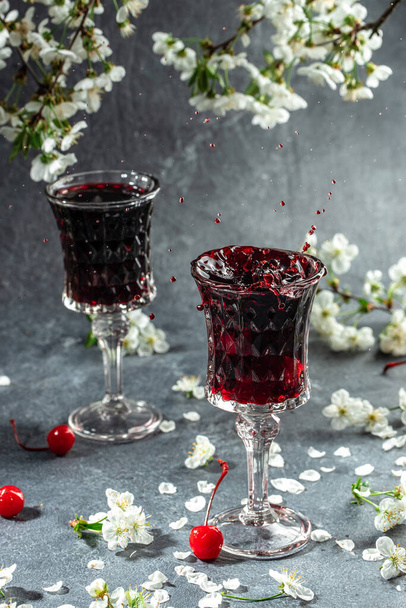 cherry alcoholic drink in a glass and fresh fruit, vertical image. top view. place for text, - Valokuva, kuva