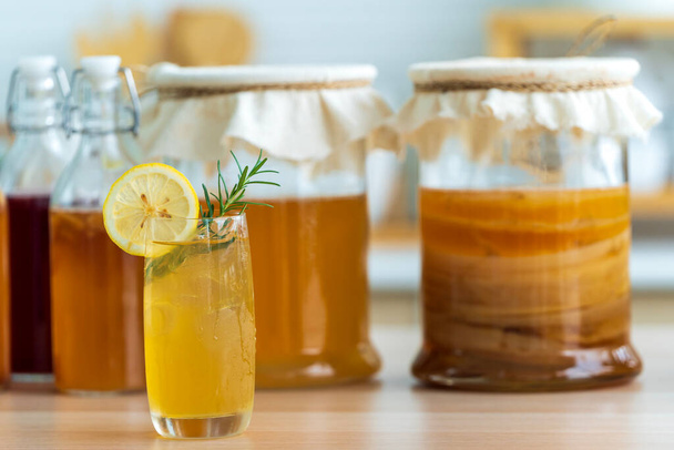 Kombucha superfood probiotic beverage in glass. Natural kombucha fermented tea beverage healthy organic drink in glass. - Foto, Imagem