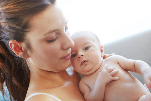 Cherishing the moment. Closeup shot of a mother holding her newborn baby - Foto, Bild