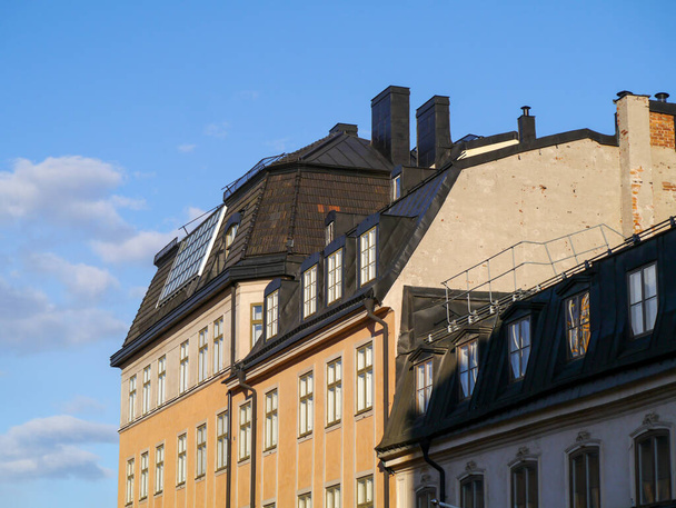 View of apartment building against blue sky  - Foto, Bild