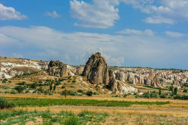 Large-scale panoramic view of Cappadocia, natural geological formations of extraordinary beauty. Famous touristic destination in Turkey - Valokuva, kuva