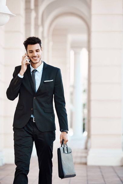 In business every conversation matters. a young handsome businessman on a call outside - Zdjęcie, obraz