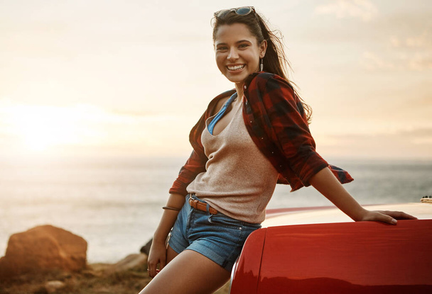 Summer doesnt get better than this. a happy young woman enjoying a summers road trip - Photo, Image