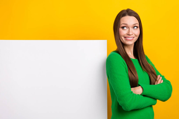 Portrait of cheerful nice girl crossed arms look empty space proposition blank isolated on yellow color background. - Photo, image