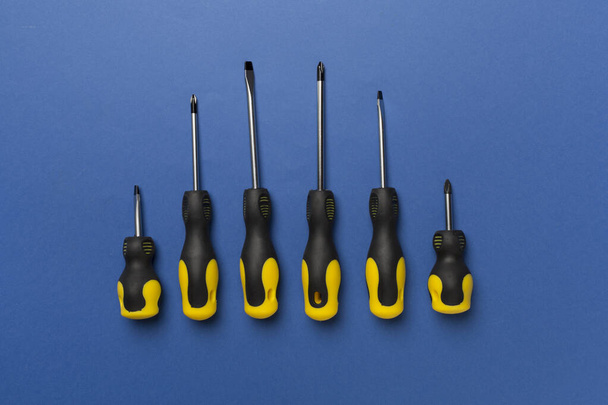 Screwdrivers on color background, top view - Photo, Image