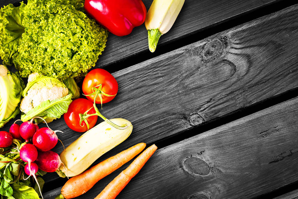 Various vegetables on an old wooden background. Copy space. Vegetables, fruits. Background - Photo, Image