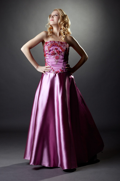 Studio photo of majestic blonde in pink dress - Zdjęcie, obraz
